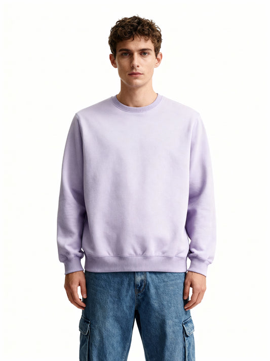 Person wearing a light purple sweatshirt and blue jeans on a white background