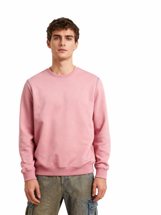 Man wearing a pink sweatshirt on a white background
