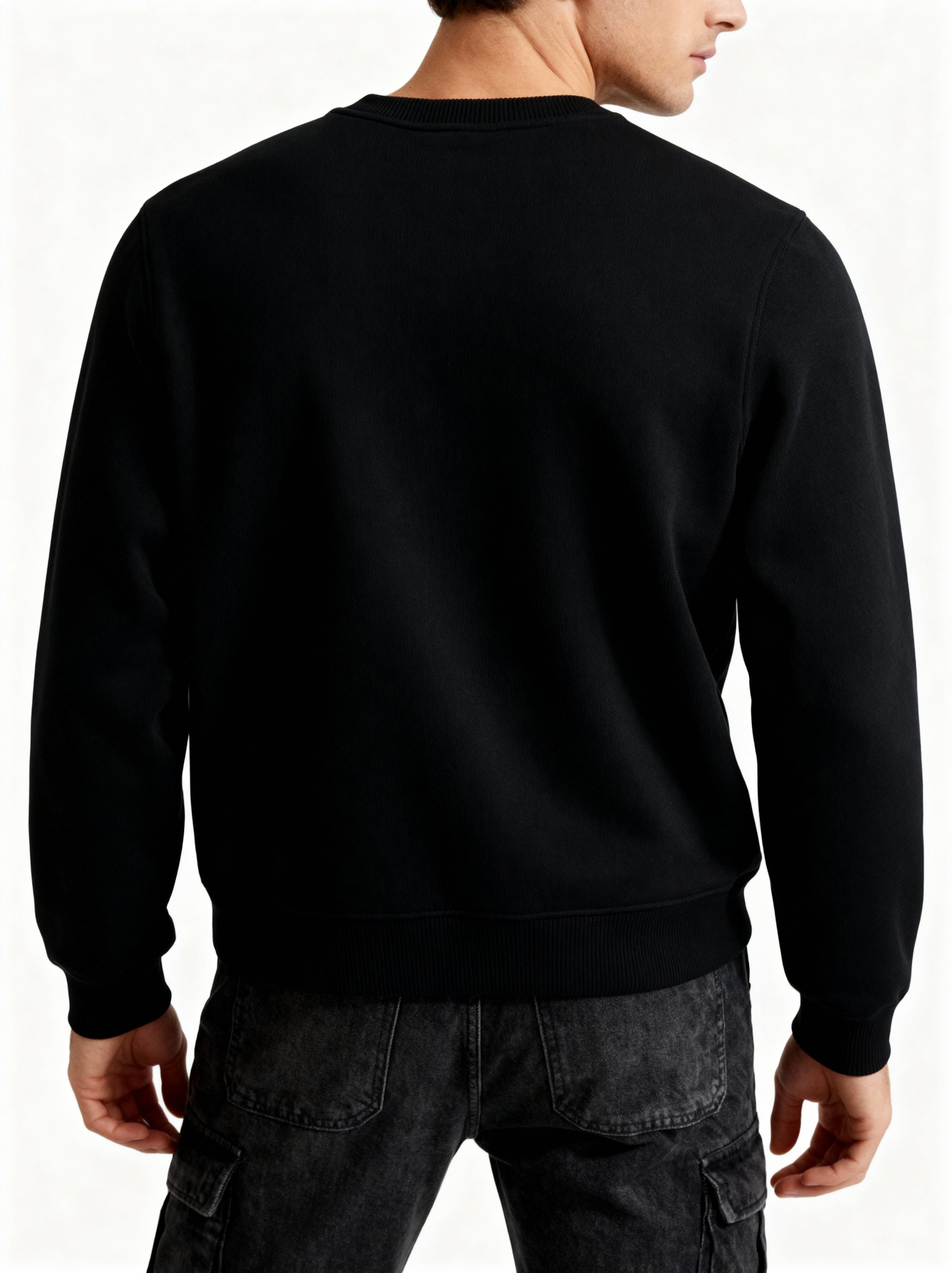 Black sweatshirt worn by a person on a white background
