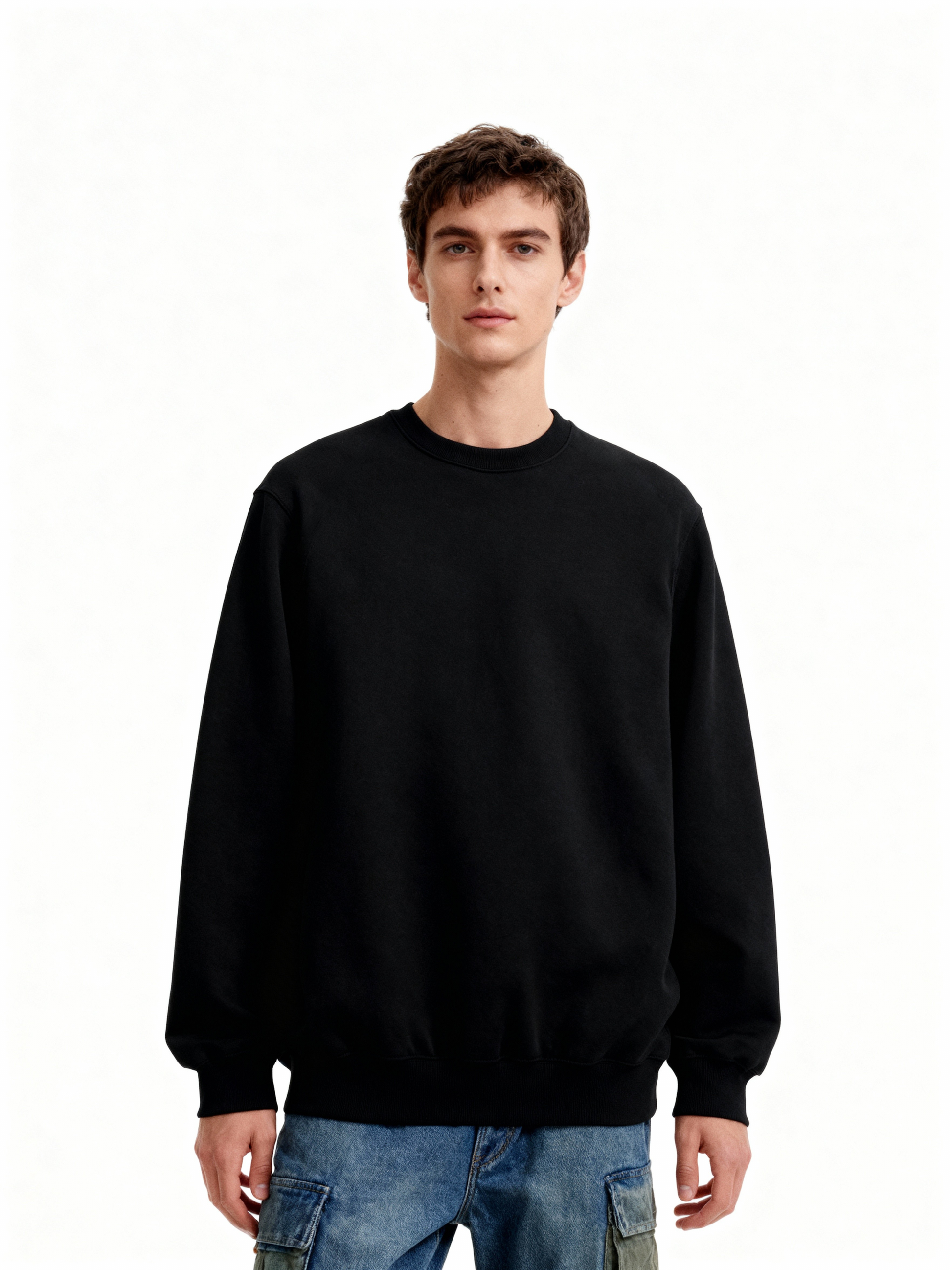 Person wearing a black sweatshirt on a white background