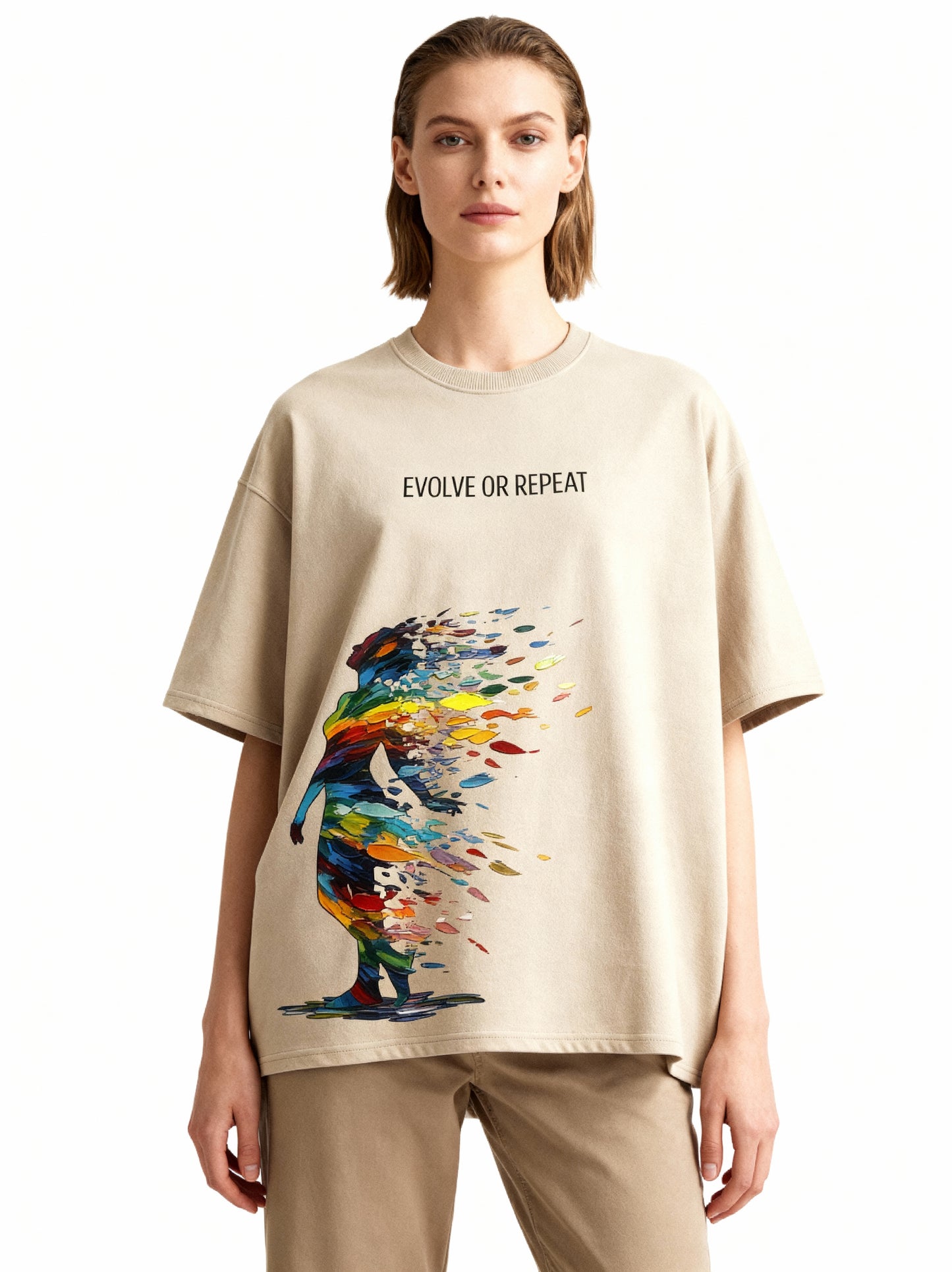 Person wearing a beige t-shirt with a colorful graphic and text 'Evolve or Repeat' on a white background