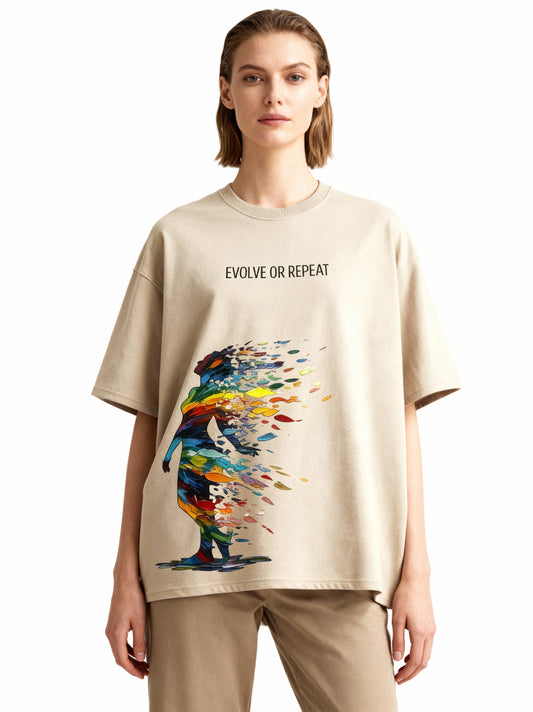 Person wearing a beige t-shirt with a colorful graphic and text 'Evolve or Repeat' on a white background