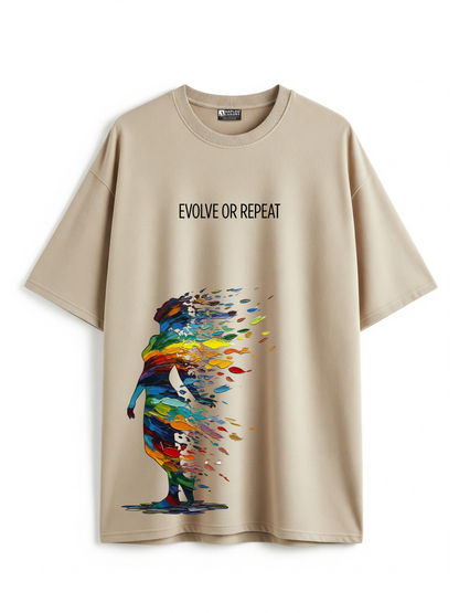 Beige t-shirt with colorful graphic and 'Evolve or Repeat' text on a white background