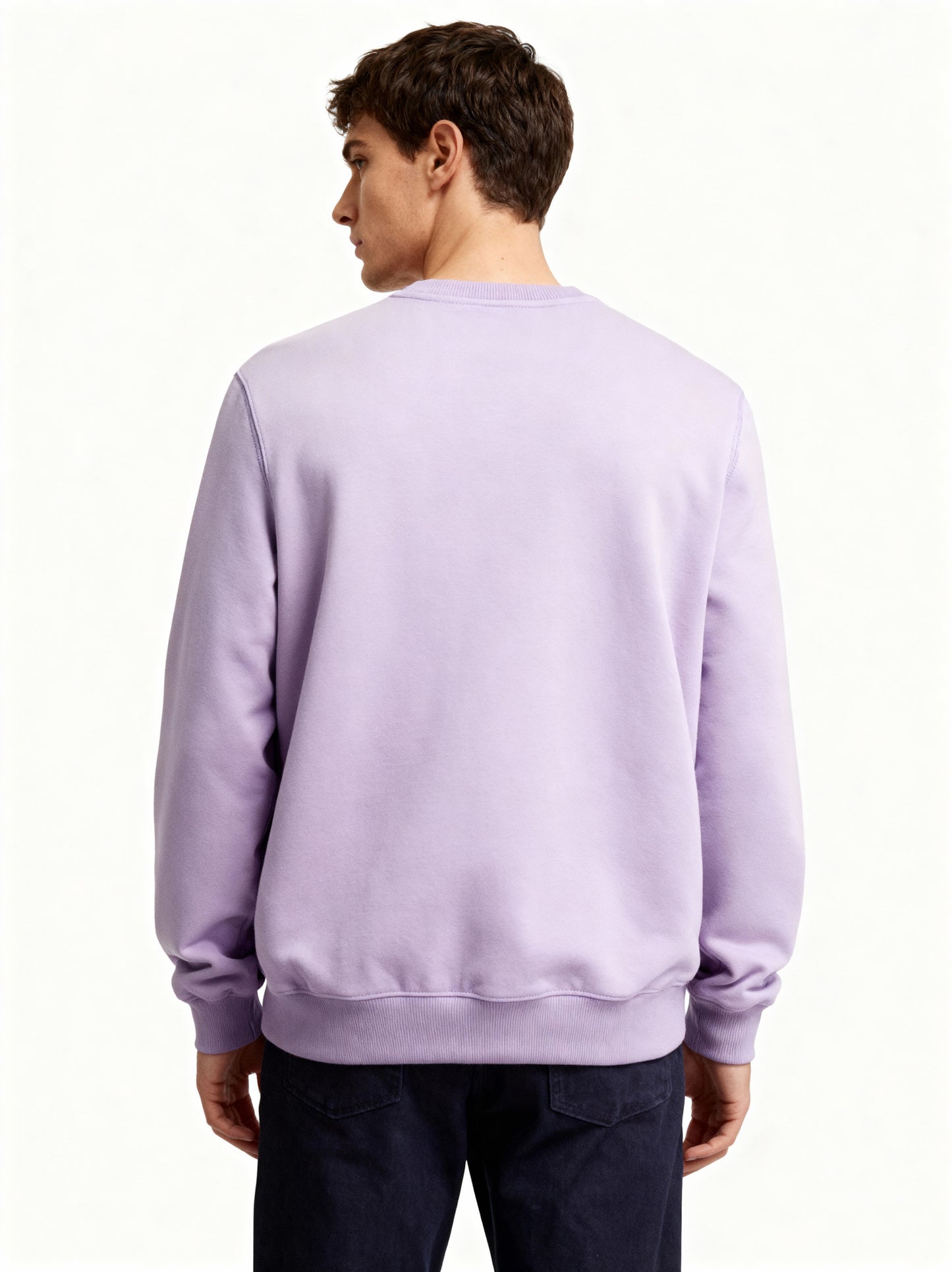 Person wearing a light purple sweatshirt on a white background