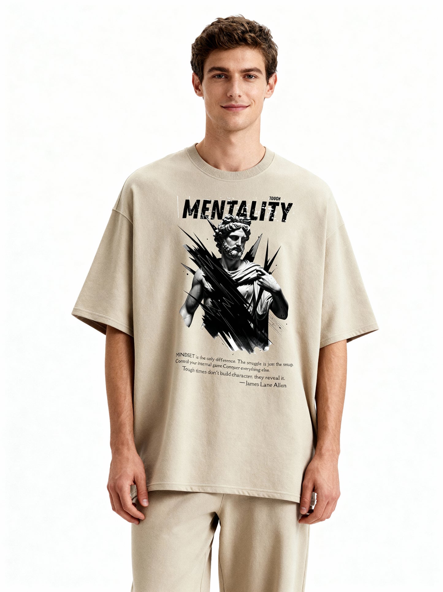 Man wearing a beige t-shirt with graphic design and text on a white background