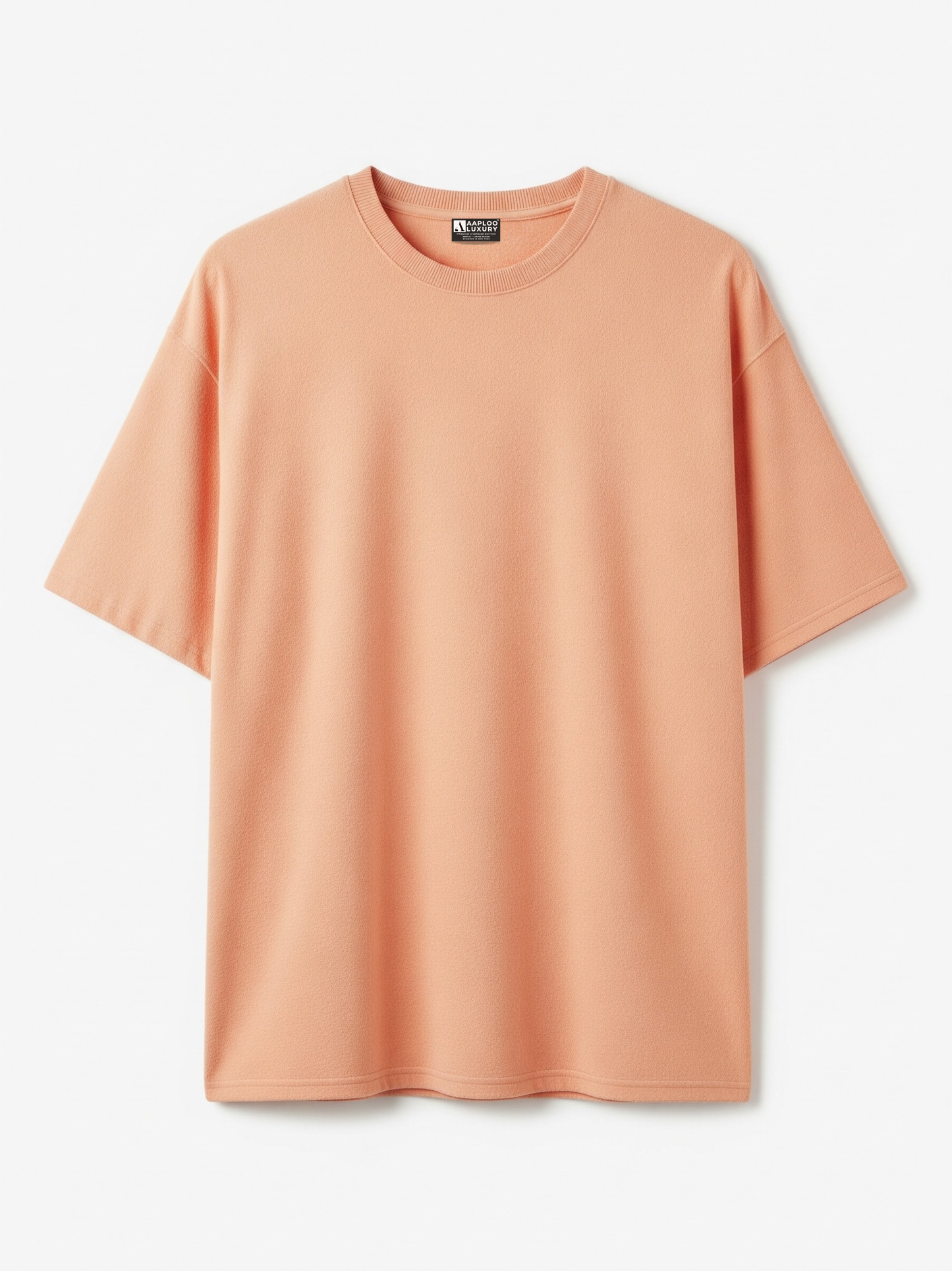 Peach-colored t-shirt on a light gray background