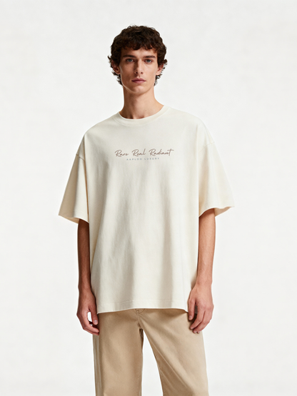 Man wearing a white t-shirt with rare real radiant text on a white background aaploo luxury idharse