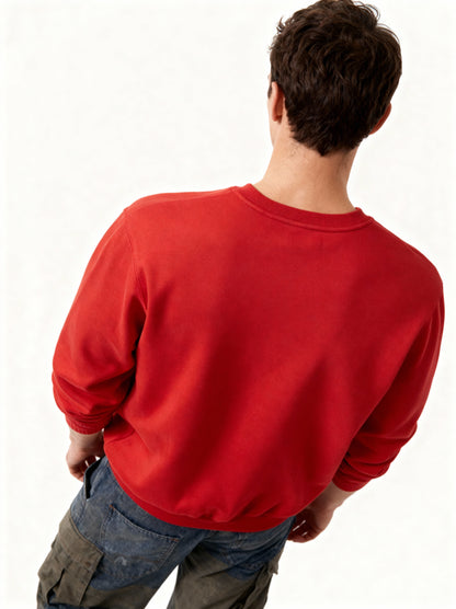 Person wearing a red sweatshirt on a white background