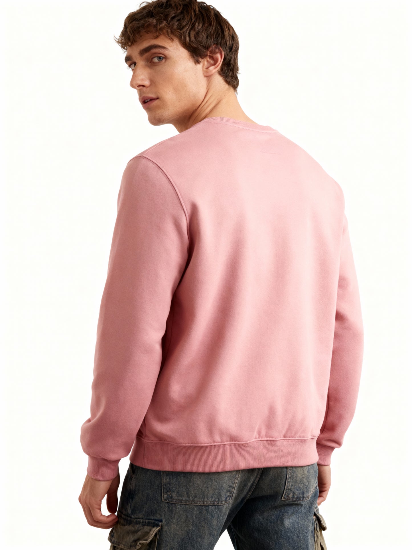 Man wearing a pink sweatshirt on a white background