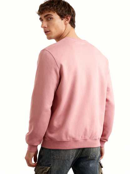 Man wearing a pink sweatshirt on a white background
