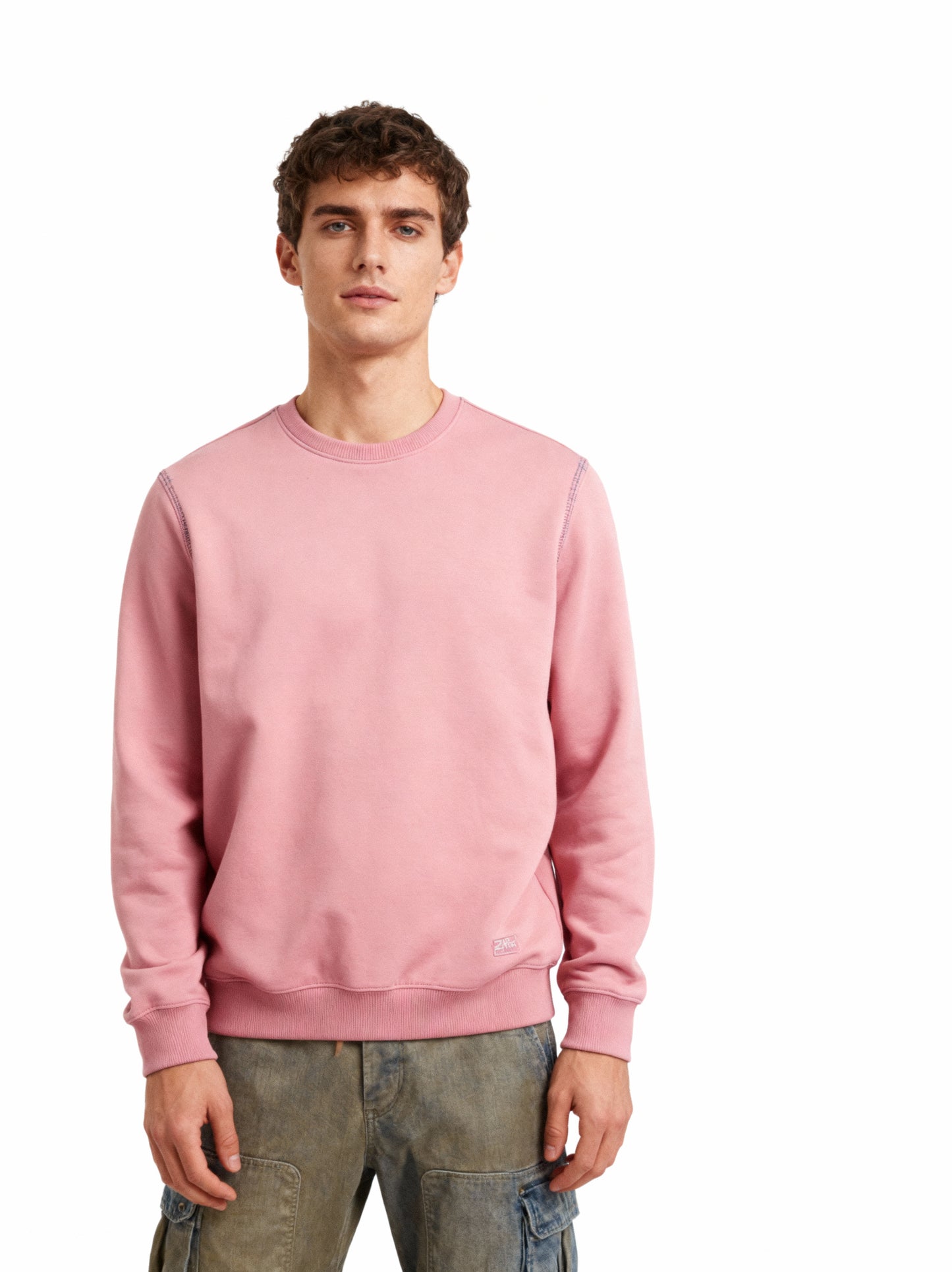 Man wearing a pink sweatshirt on a white background