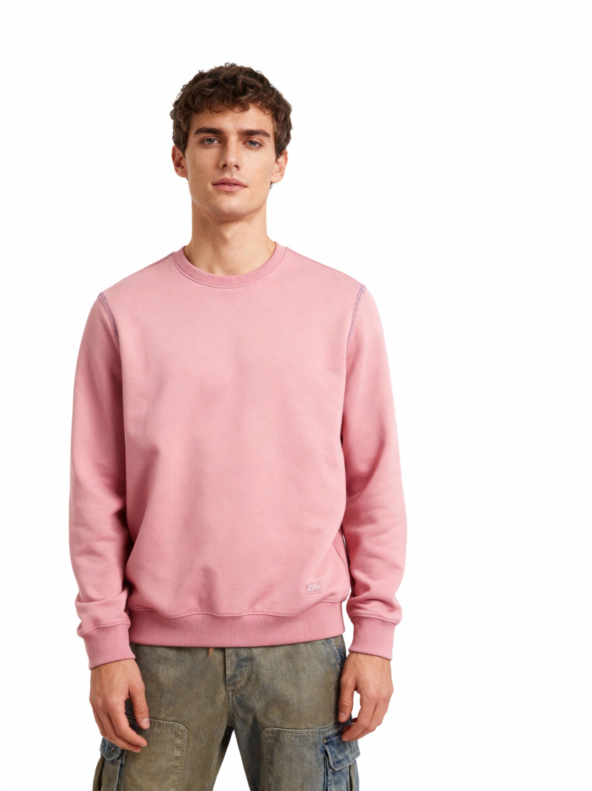 Man wearing a pink sweatshirt on a white background