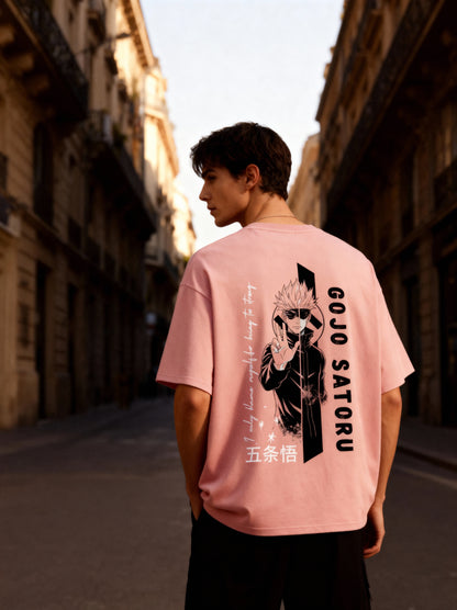 Person wearing a pink t-shirt with a graphic design and text in an urban setting