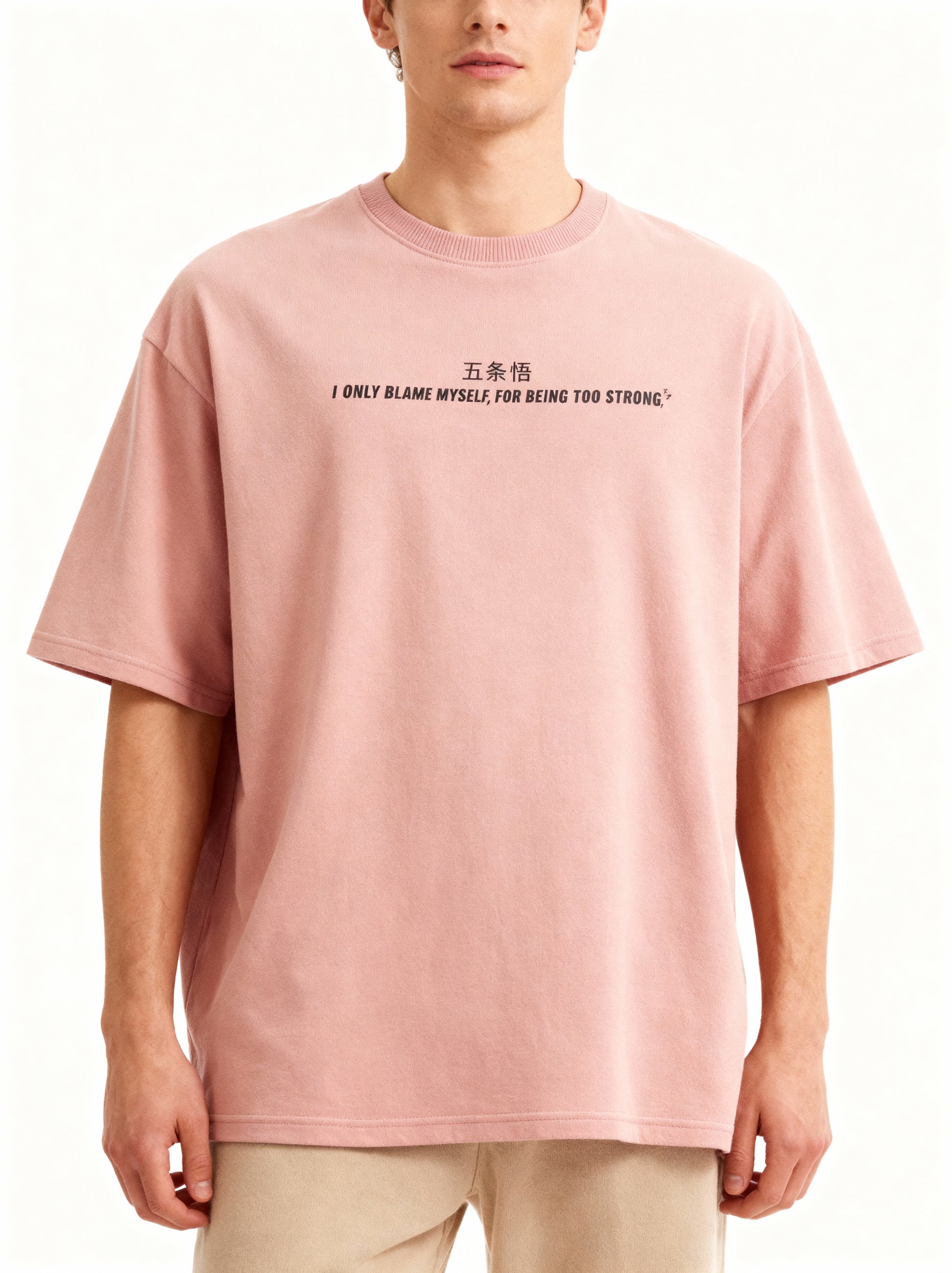Person wearing a pink t-shirt with text on a white background